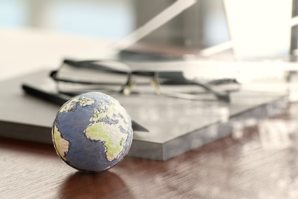 double exposure of hand drawn texture globe on wood table near note book and glasses double exposure of hand drawn texture globe on wood table near note book and glasses